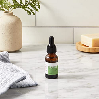 Bottle of My Mommy Wisdom pH Balancer - Yoni Oil sitting on top of bathroom counter